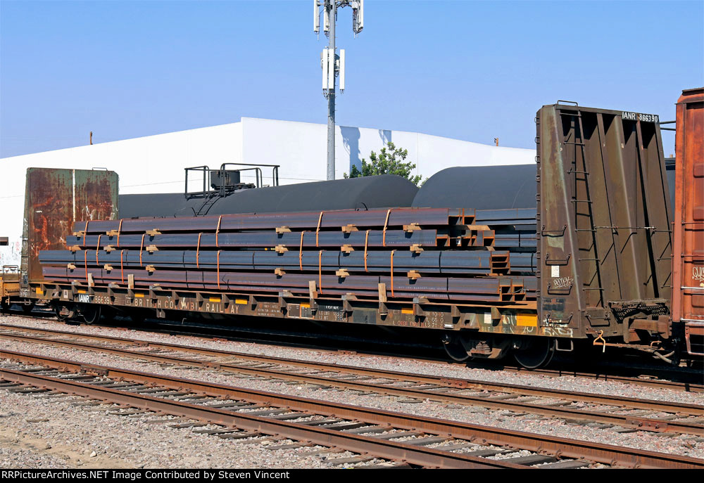 Ex BC Railway bulkhead flat IANR #866390 with a load of steel.